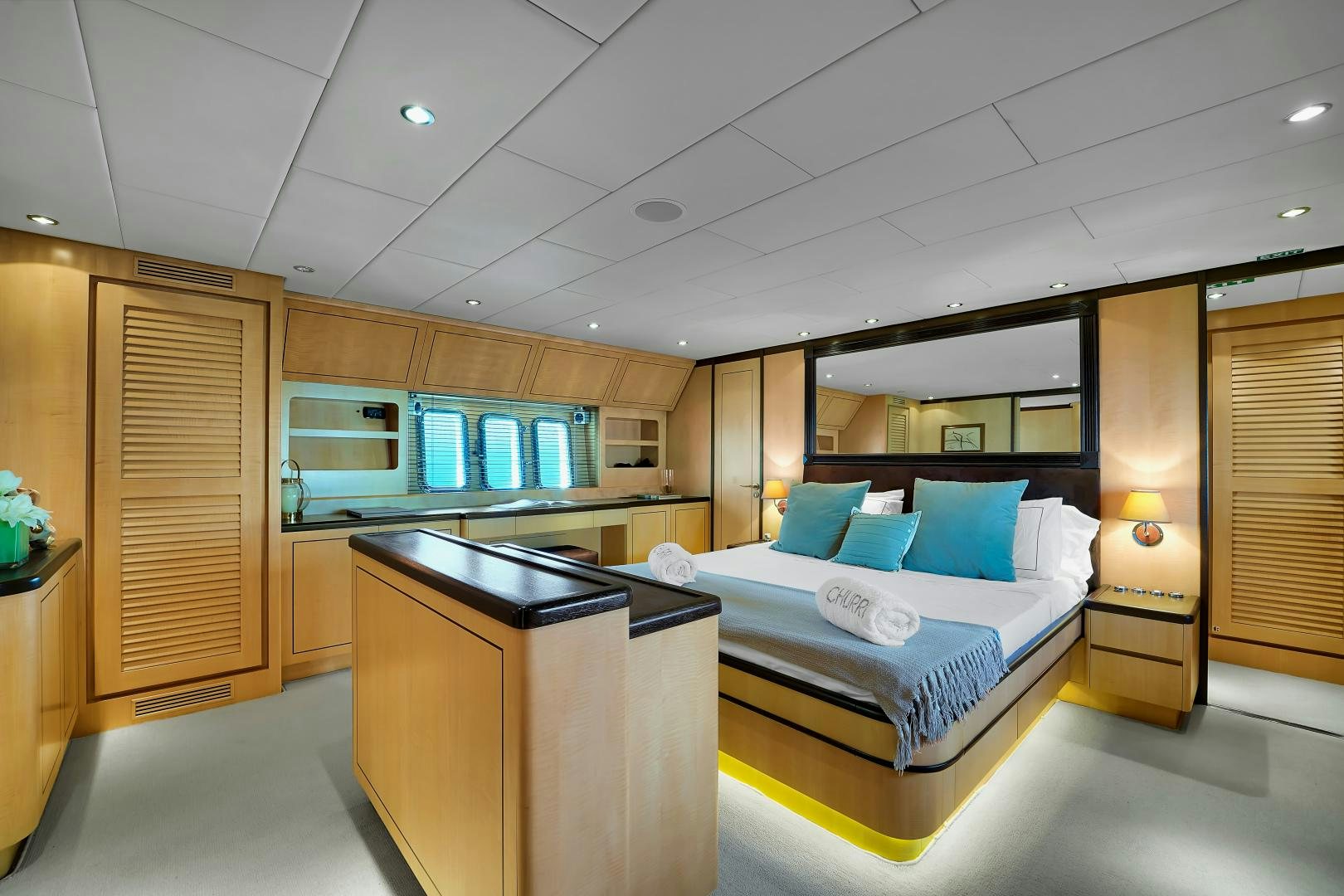 a room with a bed and a desk aboard CHURRI Yacht for Sale