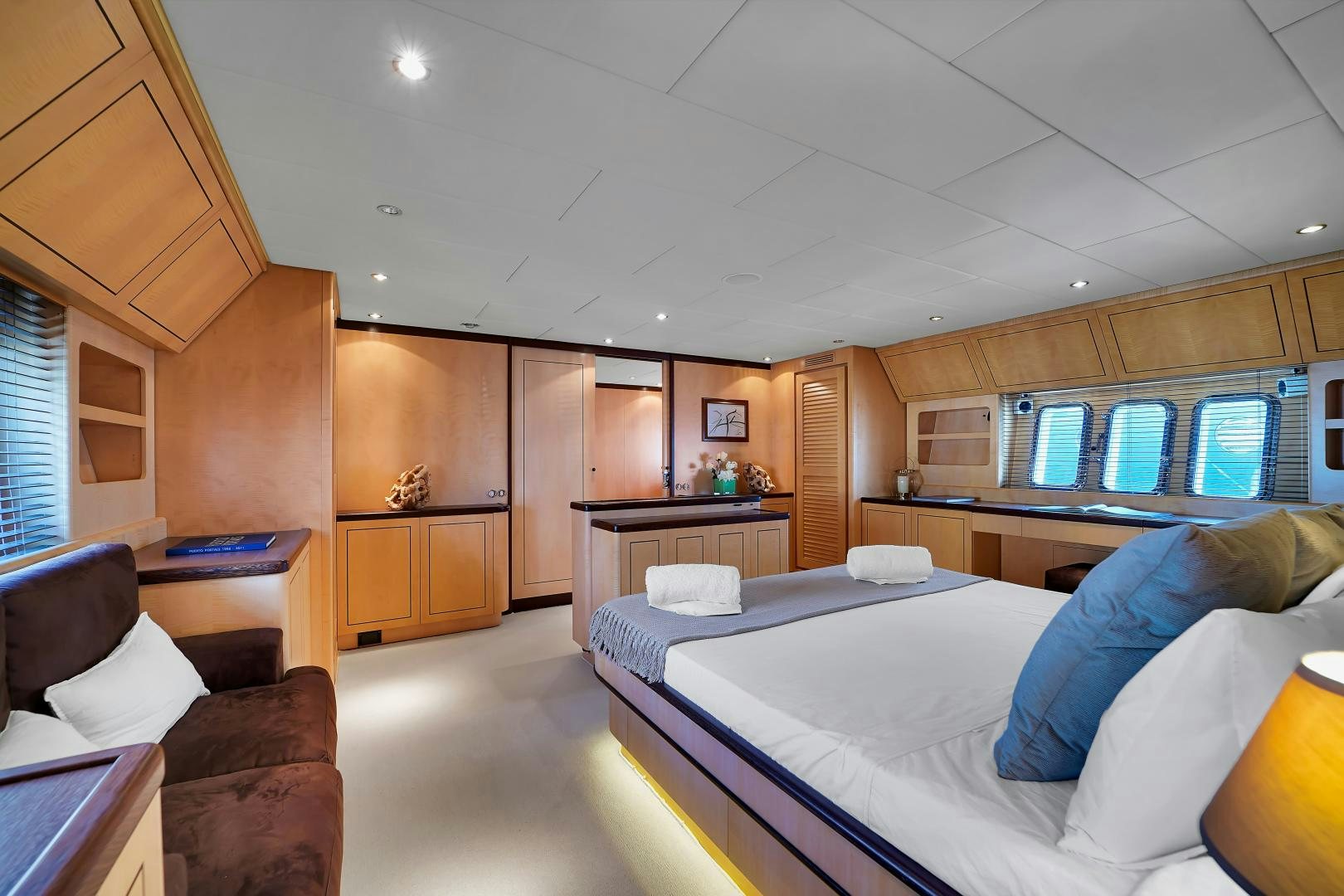 a bedroom with a bed and a couch aboard CHURRI Yacht for Sale