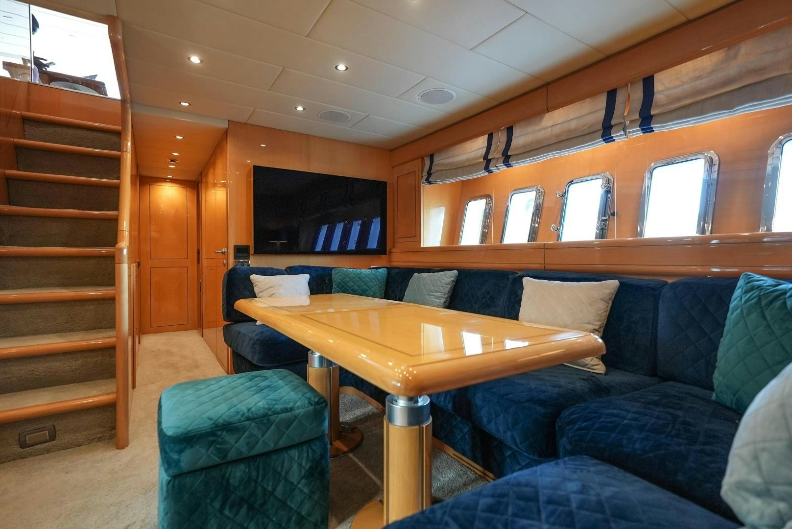 a living room with a couch and a table aboard QUERENCIA Yacht for Sale