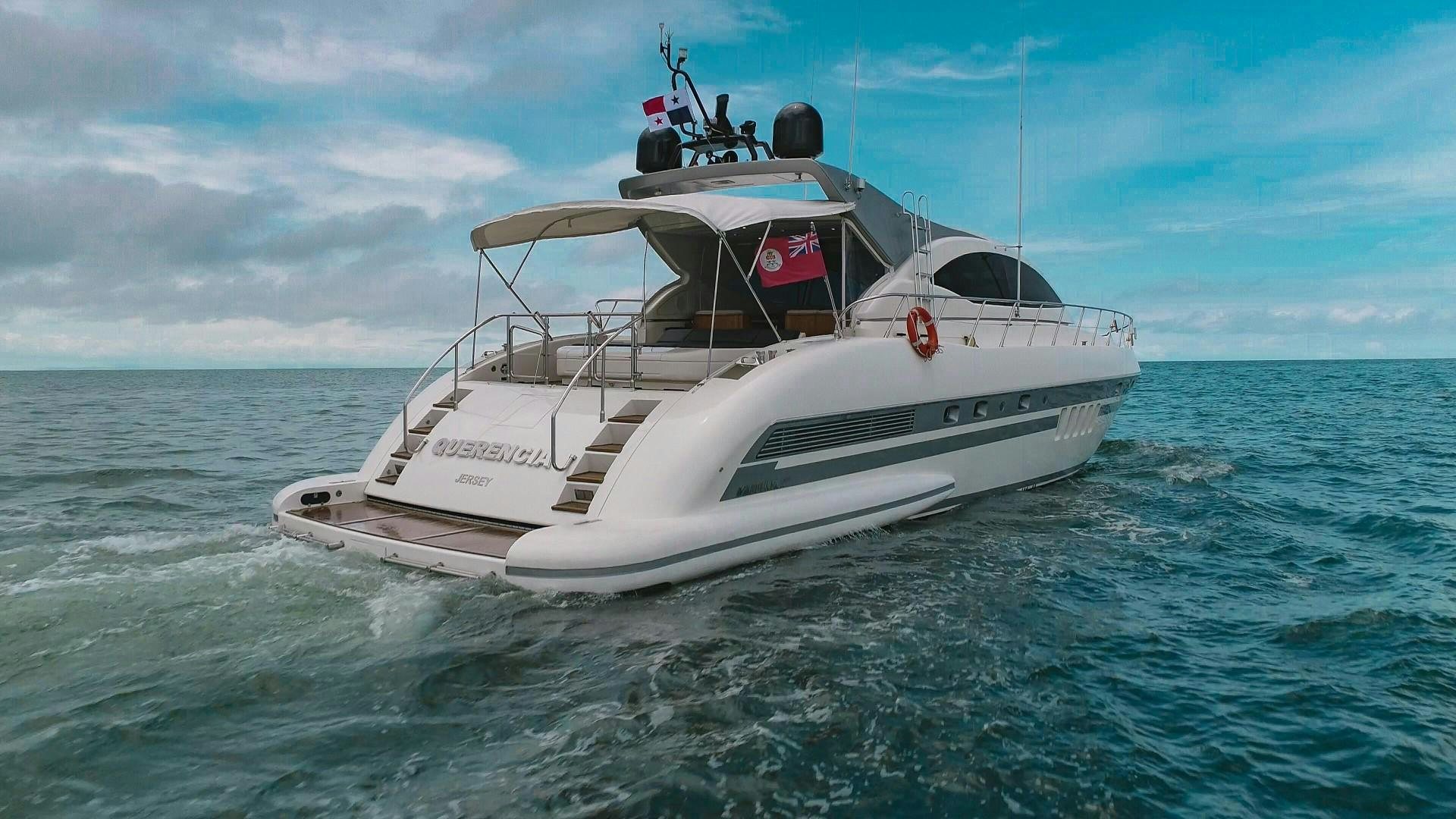 a white yacht in the water aboard QUERENCIA Yacht for Sale