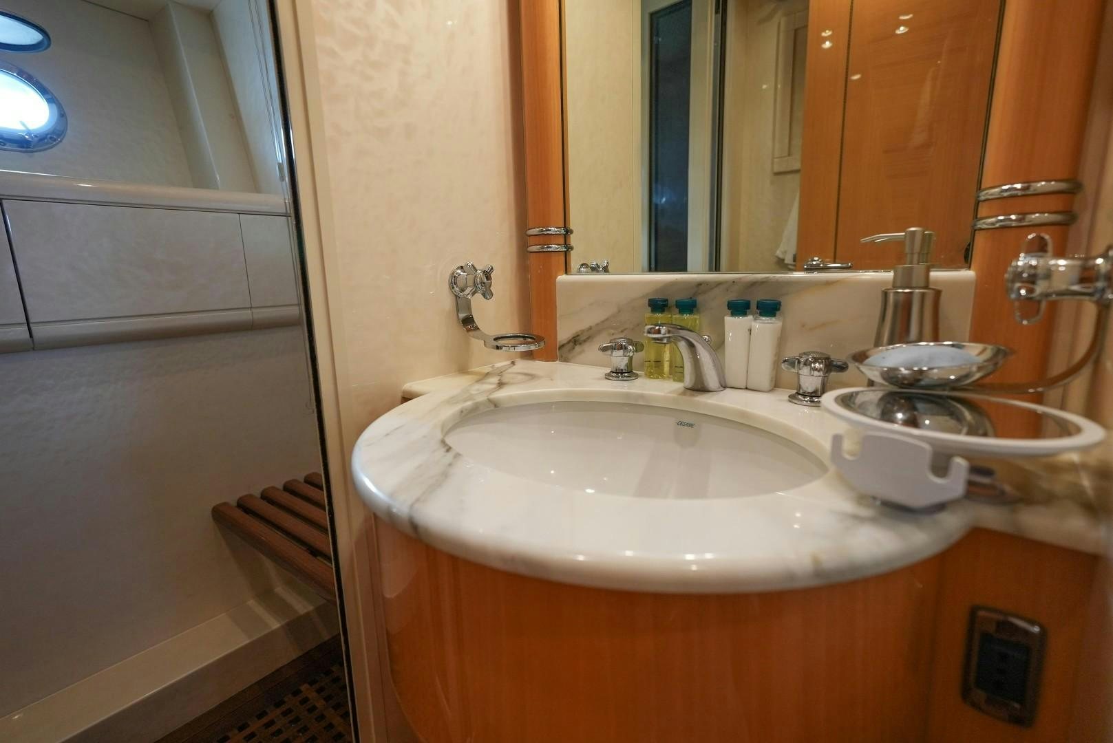 a bathroom with a sink and a mirror aboard QUERENCIA Yacht for Sale