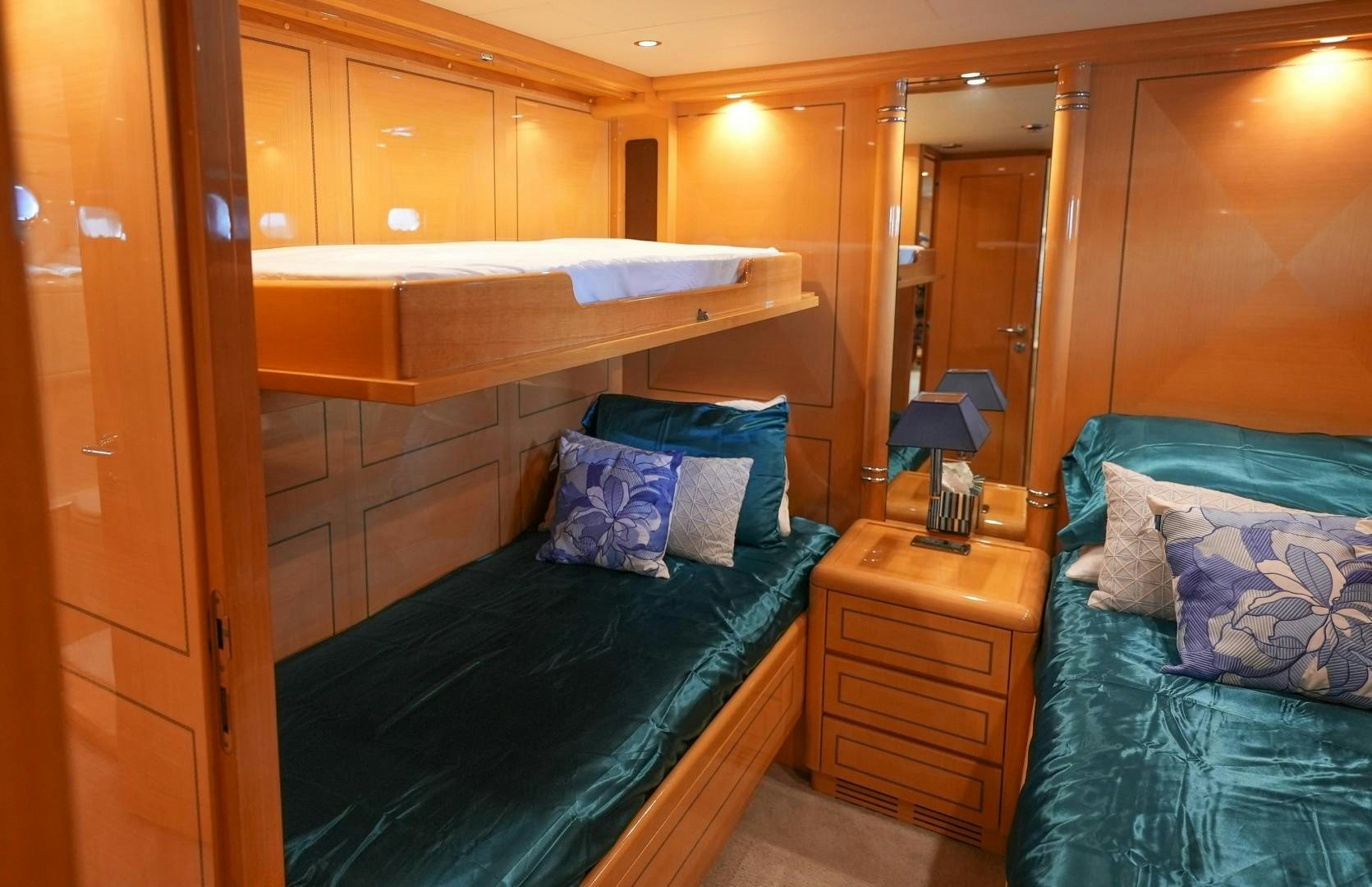 a bedroom with a bed and a mirror aboard QUERENCIA Yacht for Sale