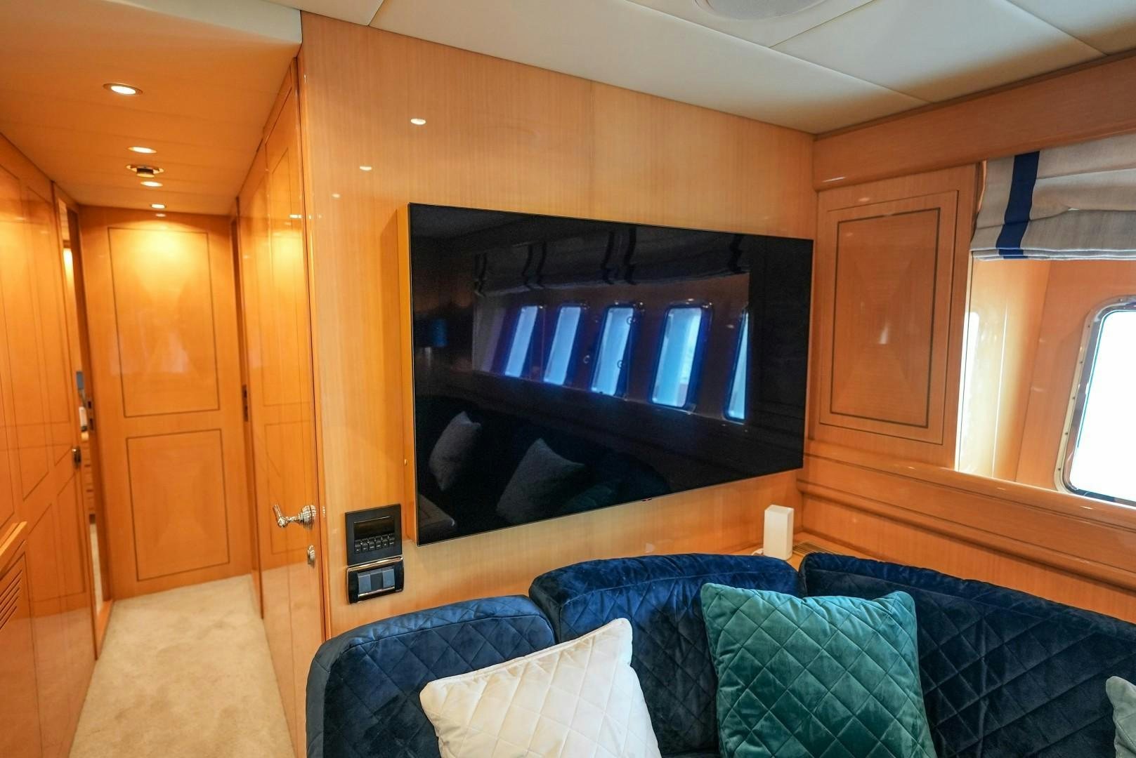 a living room with a large television aboard QUERENCIA Yacht for Sale