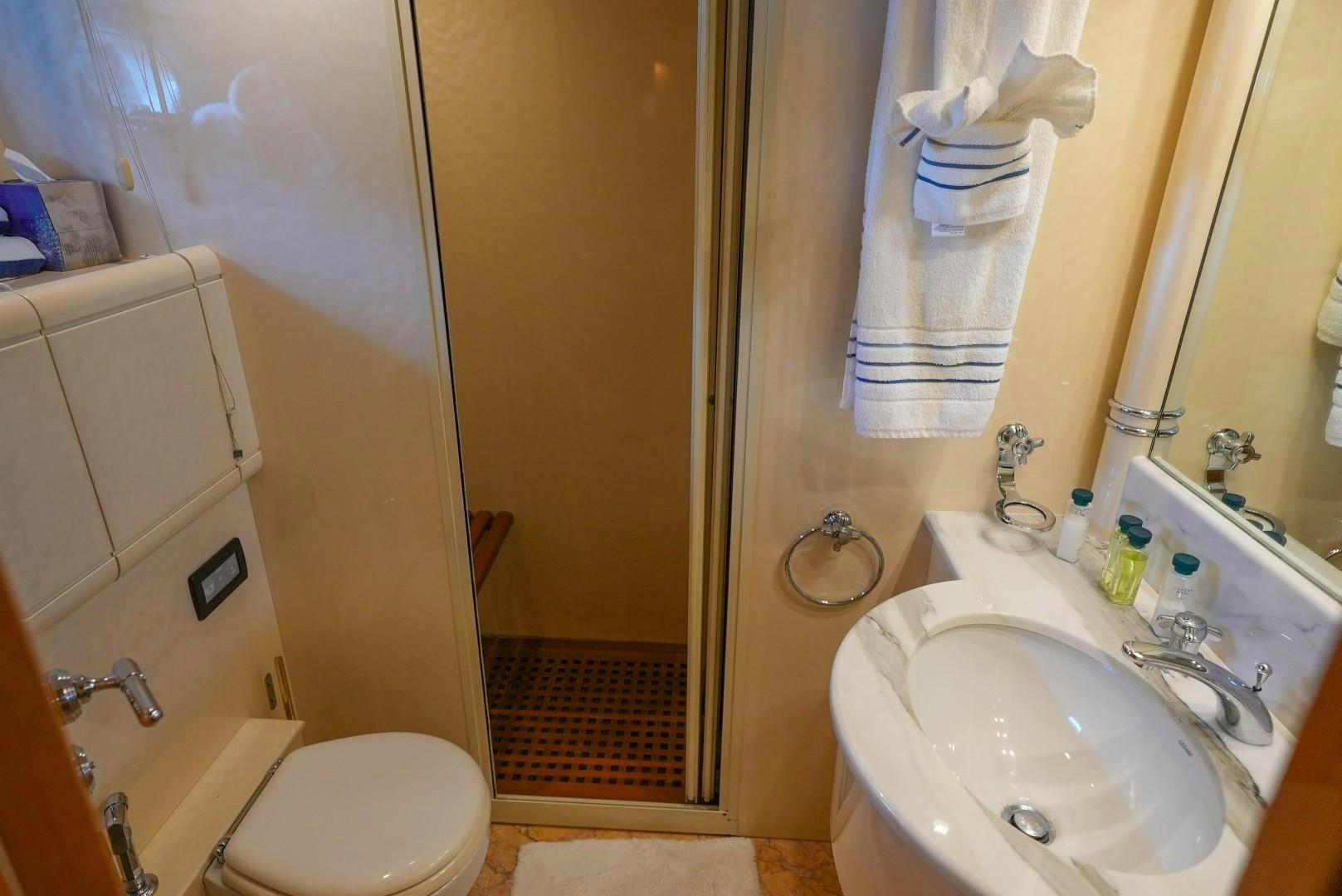 a bathroom with a sink and a toilet aboard QUERENCIA Yacht for Sale
