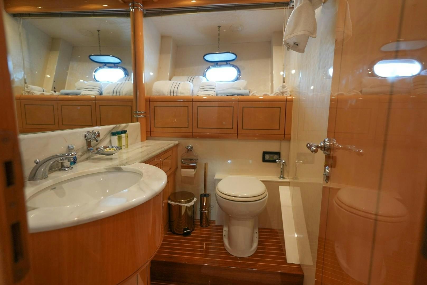 a bathroom with a toilet sink and a bathtub aboard QUERENCIA Yacht for Sale