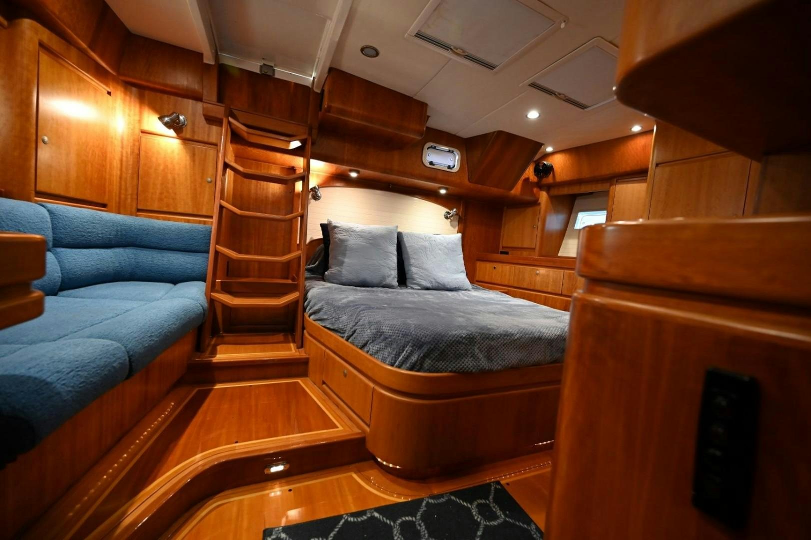 a room with a bed and a couch aboard SIRONA Yacht for Sale
