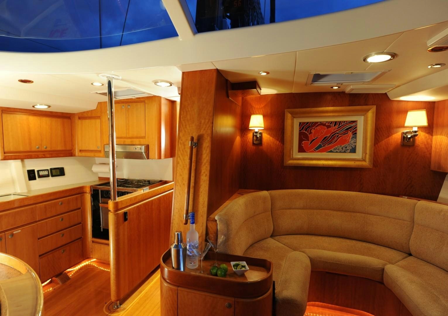 a living room with a couch and a table aboard SIRONA Yacht for Sale
