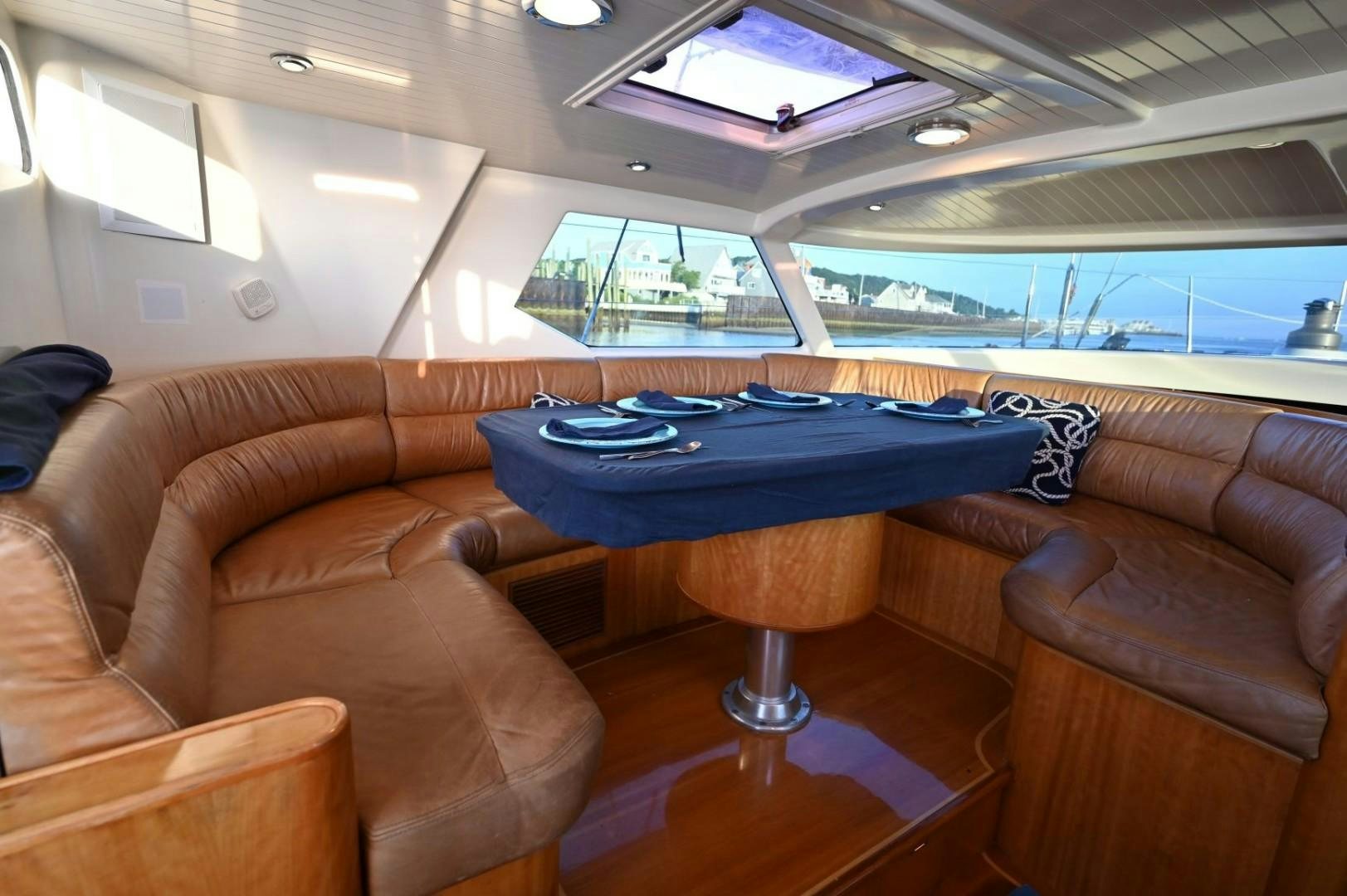 a living room with a couch and a table aboard SIRONA Yacht for Sale