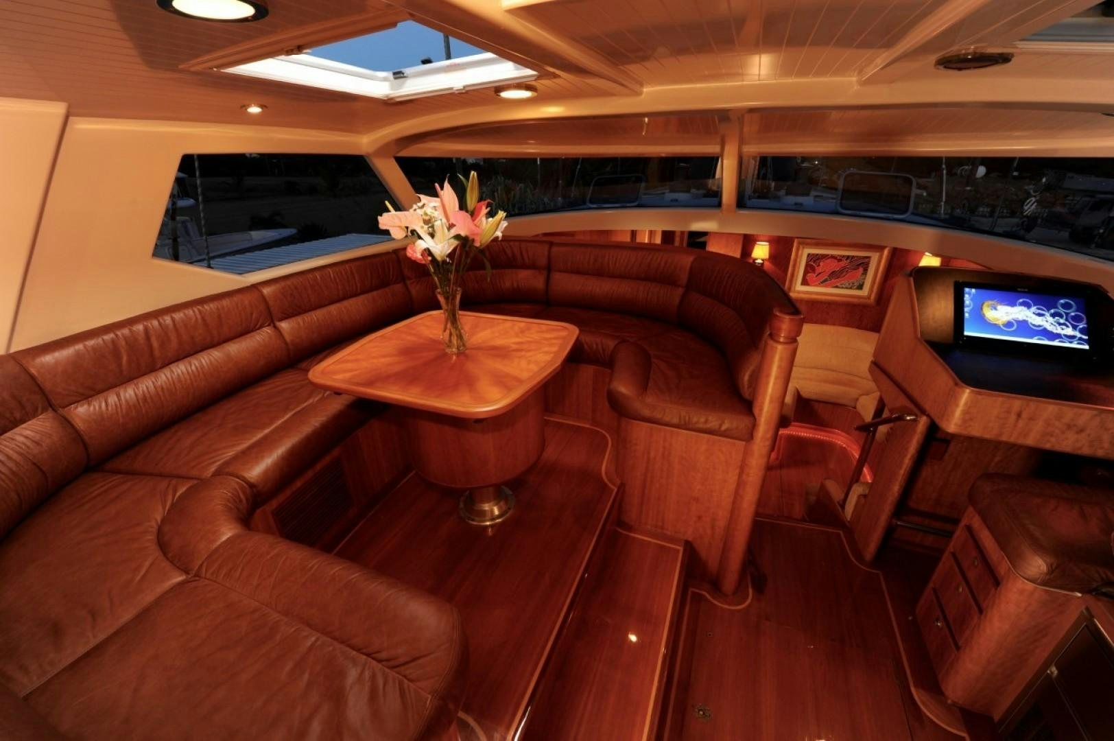 a room with a couch and a table and a tv aboard SIRONA Yacht for Sale