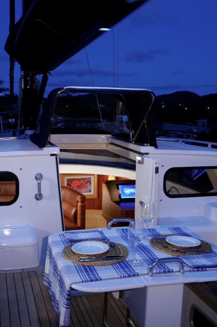 a table with plates and a plate on it aboard SIRONA Yacht for Sale