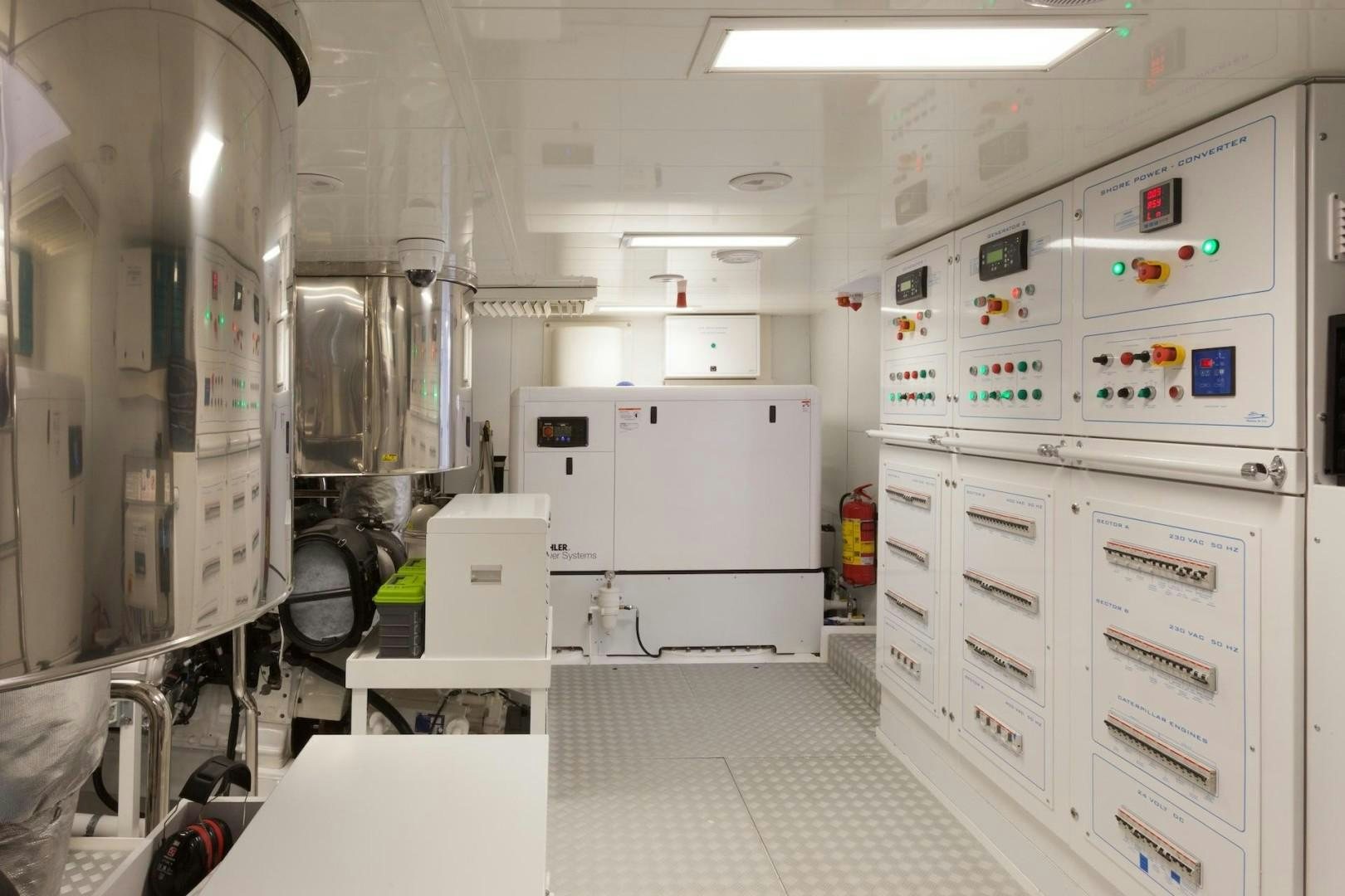 a room with several white machines aboard ACALA Yacht for Sale