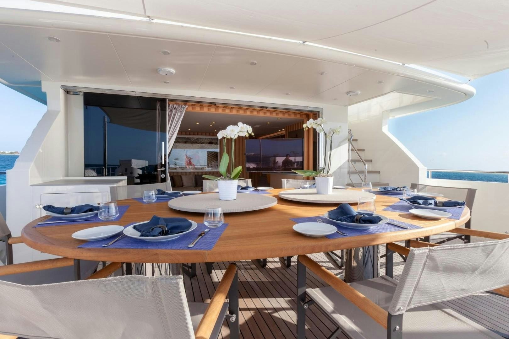a table with plates and cups on it aboard ACALA Yacht for Sale