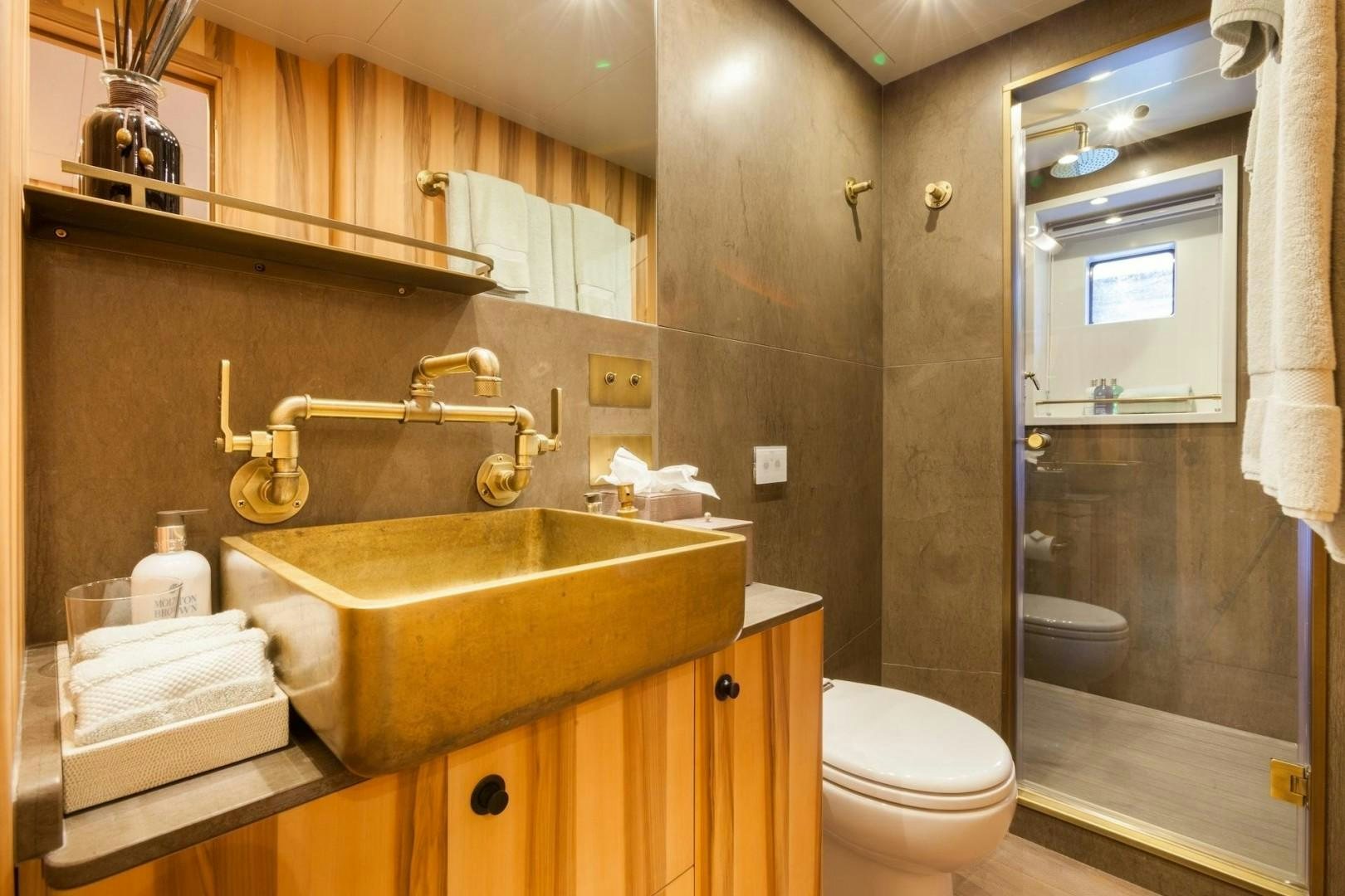 a bathroom with a sink and toilet aboard ACALA Yacht for Sale