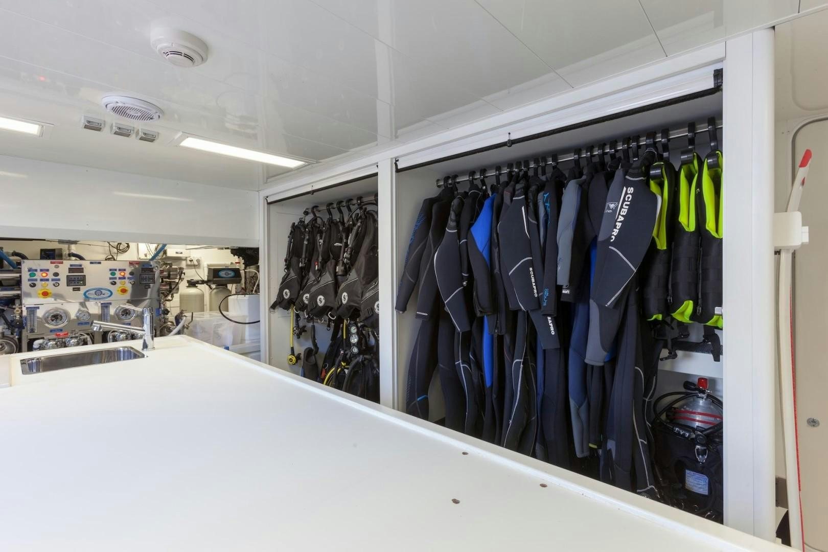 a closet full of clothes aboard ACALA Yacht for Sale