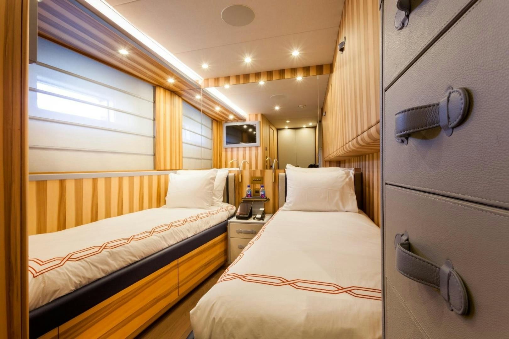 a room with two beds aboard ACALA Yacht for Sale