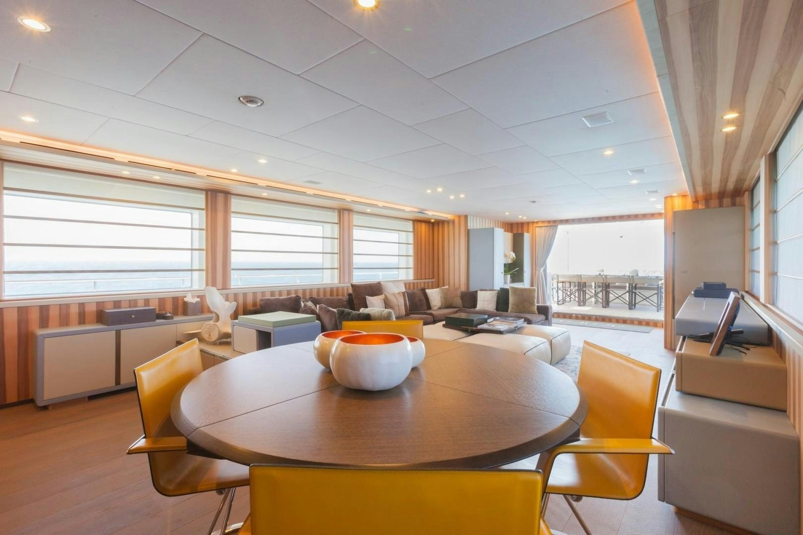 a modern looking living room aboard ACALA Yacht for Sale