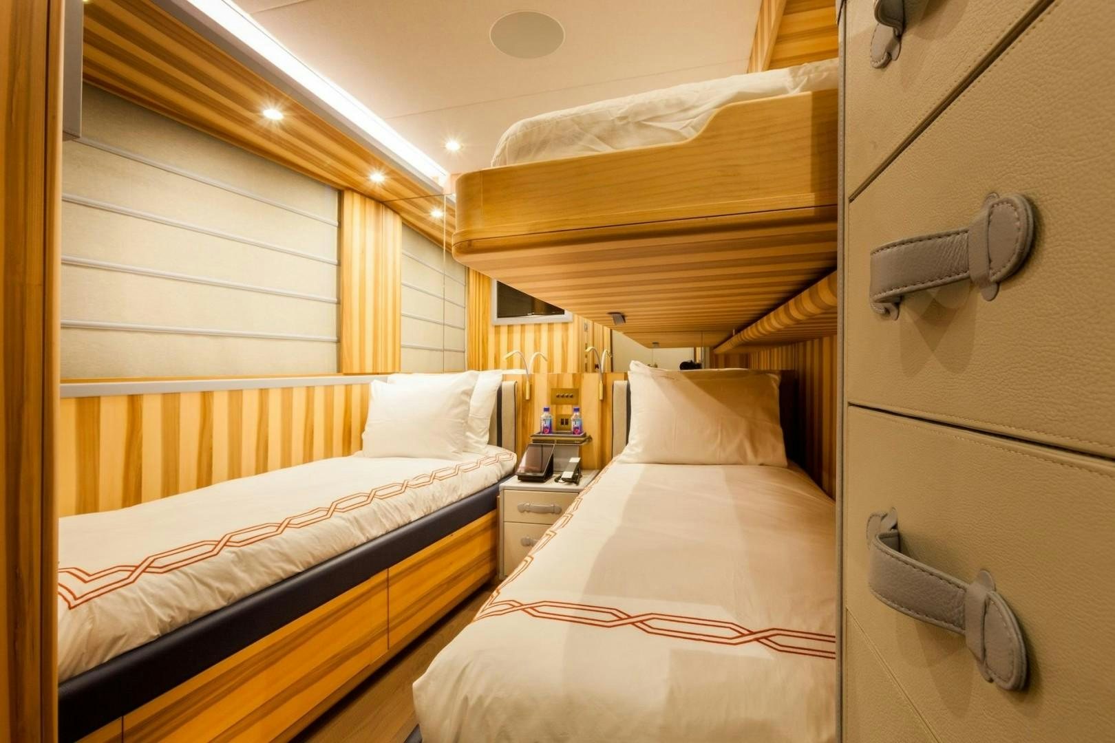 a couple of beds in a room aboard ACALA Yacht for Sale