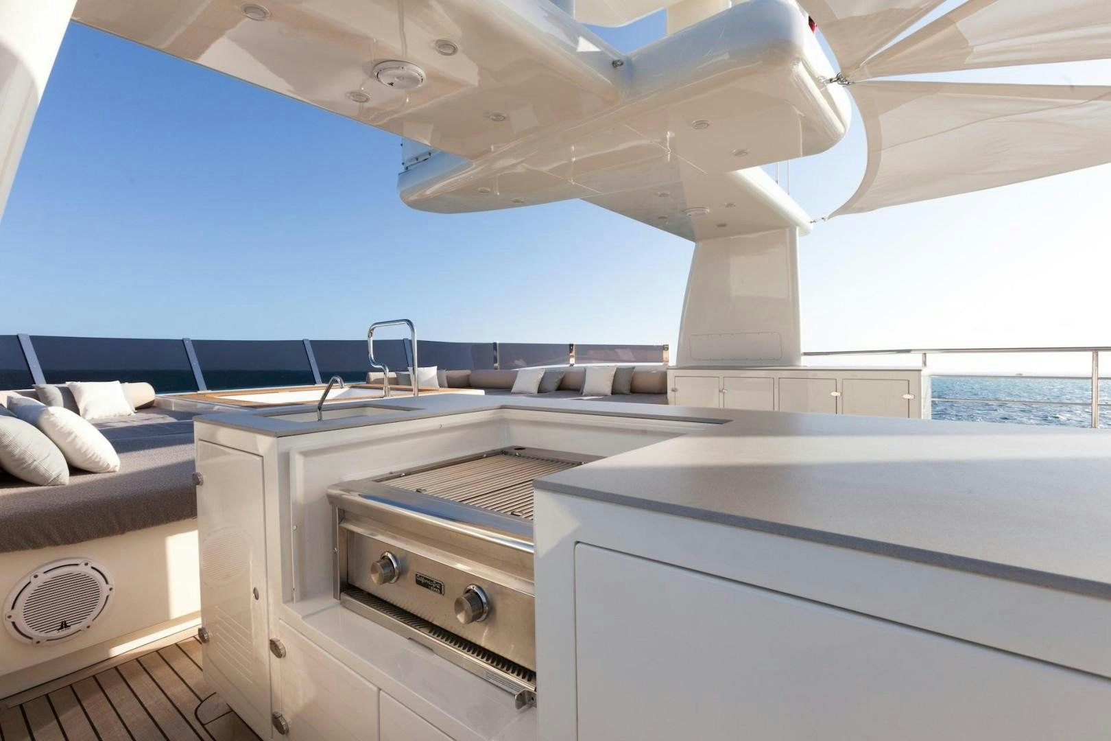 a room with a large window and a desk with a computer aboard ACALA Yacht for Sale