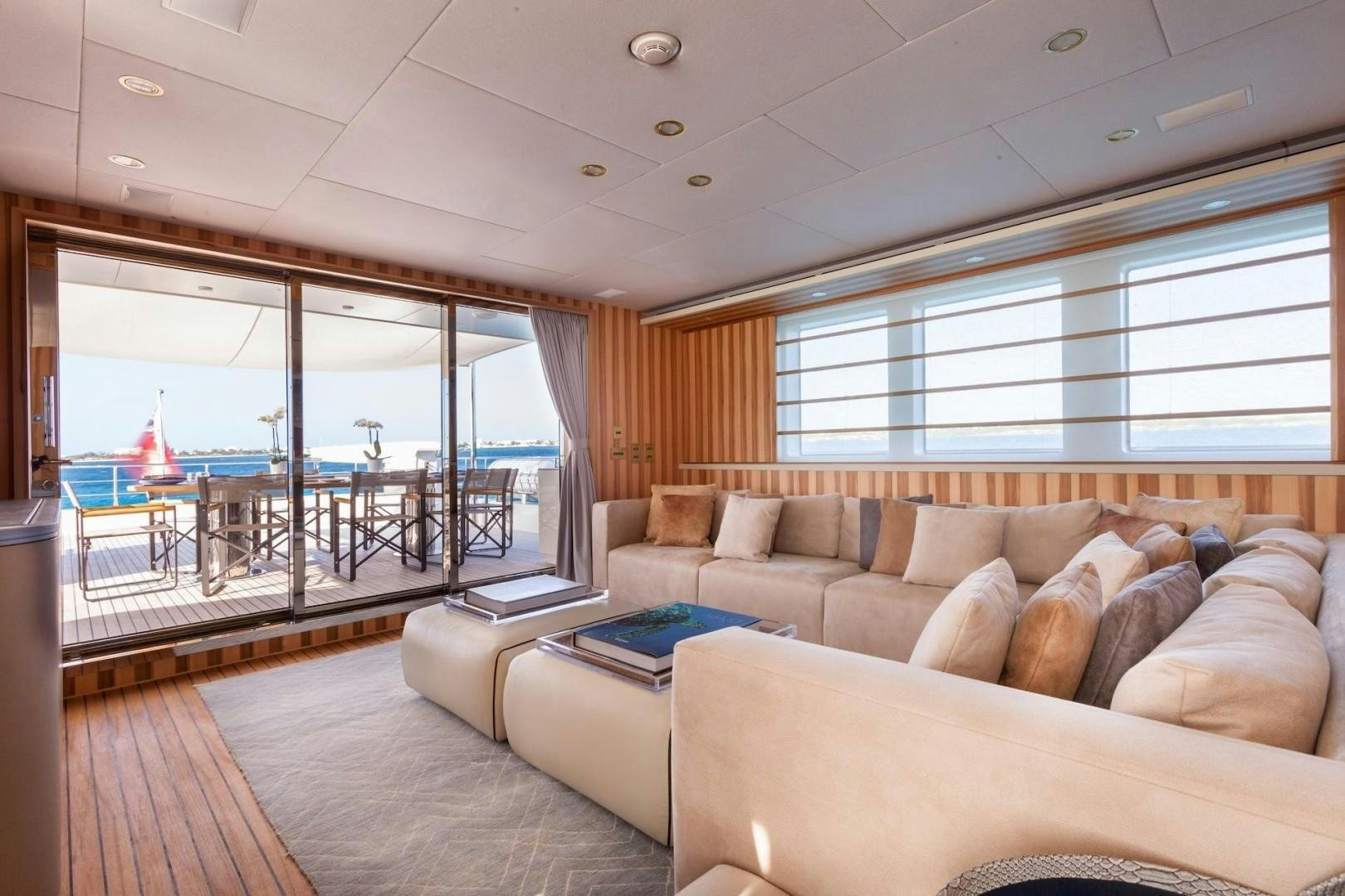 a living room with a large window aboard ACALA Yacht for Sale
