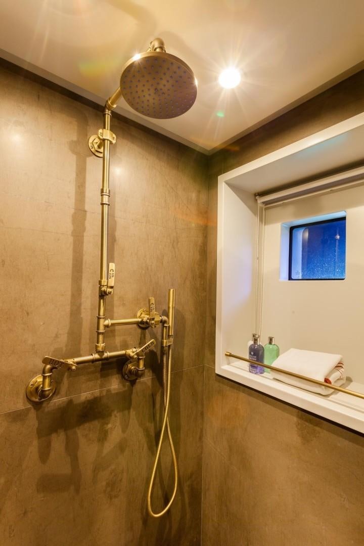 a bathroom with a mirror and a sink aboard ACALA Yacht for Sale