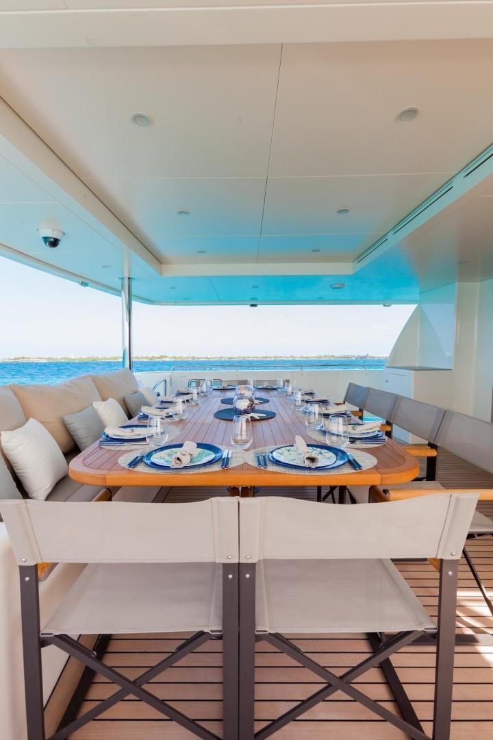 a dining table in a room aboard ACALA Yacht for Sale