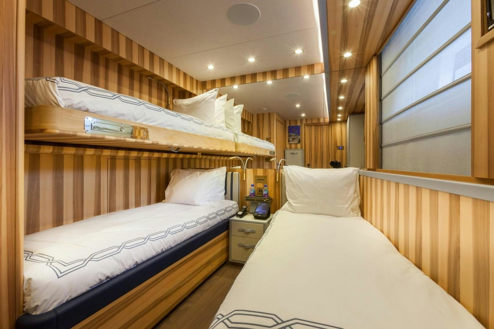 a couple of beds in a room aboard ACALA Yacht for Sale