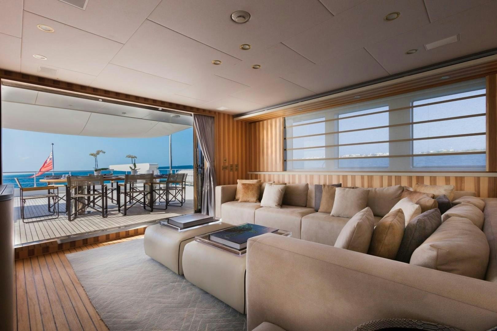 a living room with a large window aboard ACALA Yacht for Sale