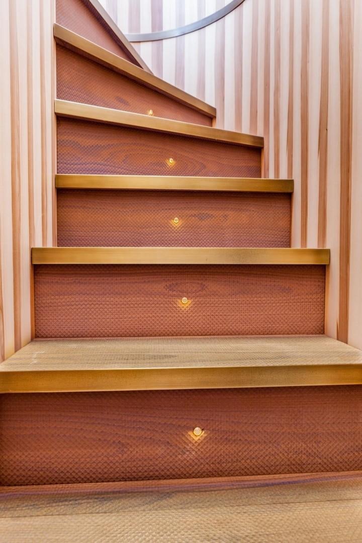 a set of wooden stairs aboard ACALA Yacht for Sale