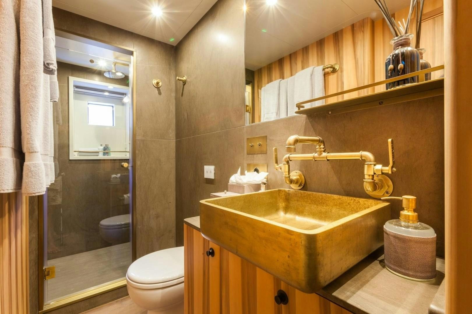 a bathroom with a sink and toilet aboard ACALA Yacht for Sale