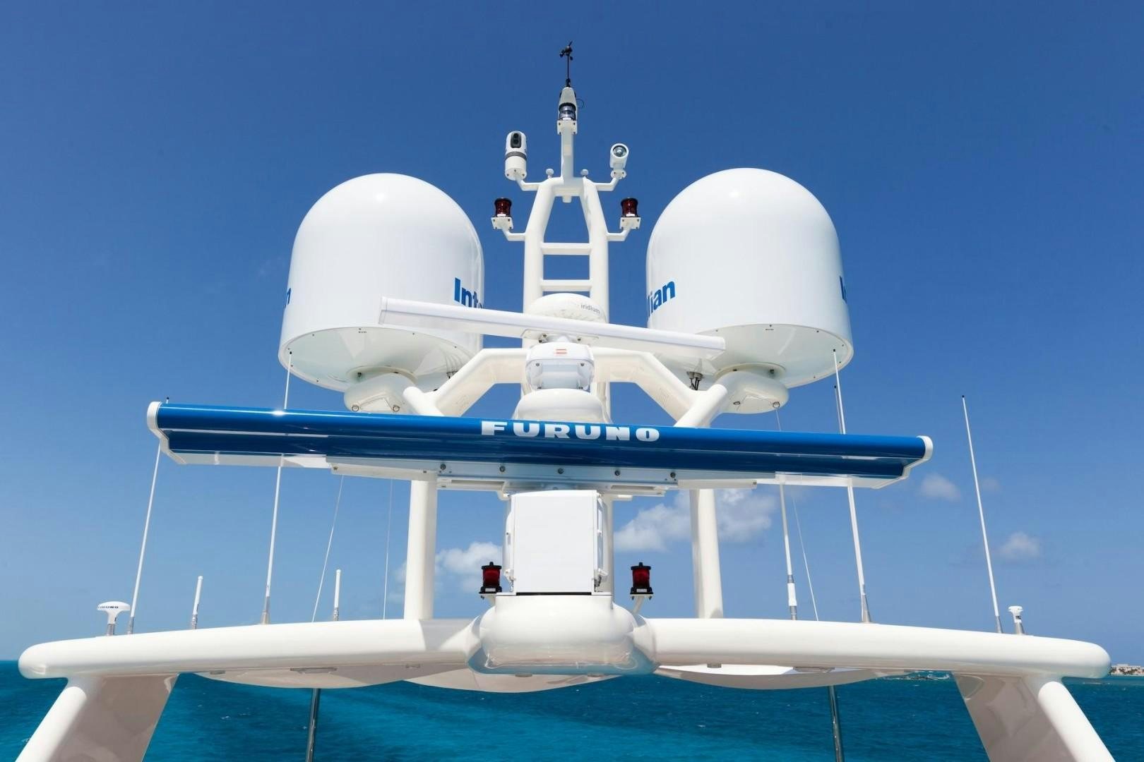 a white and blue airplane aboard ACALA Yacht for Sale