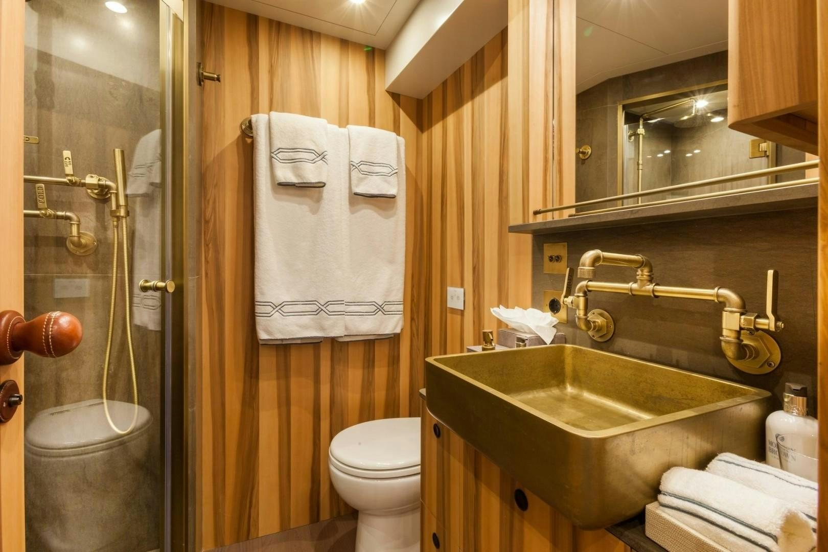 a bathroom with a sink toilet and a bathtub aboard ACALA Yacht for Sale
