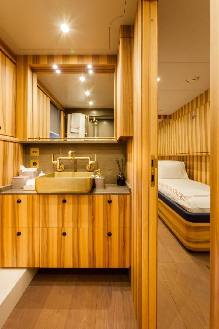 a bathroom with a sink and a mirror aboard ACALA Yacht for Sale