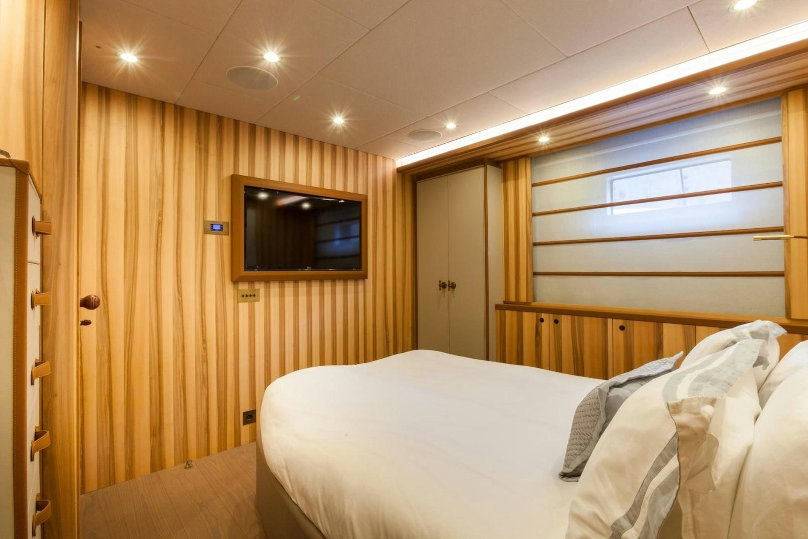 a room with two beds aboard ACALA Yacht for Sale