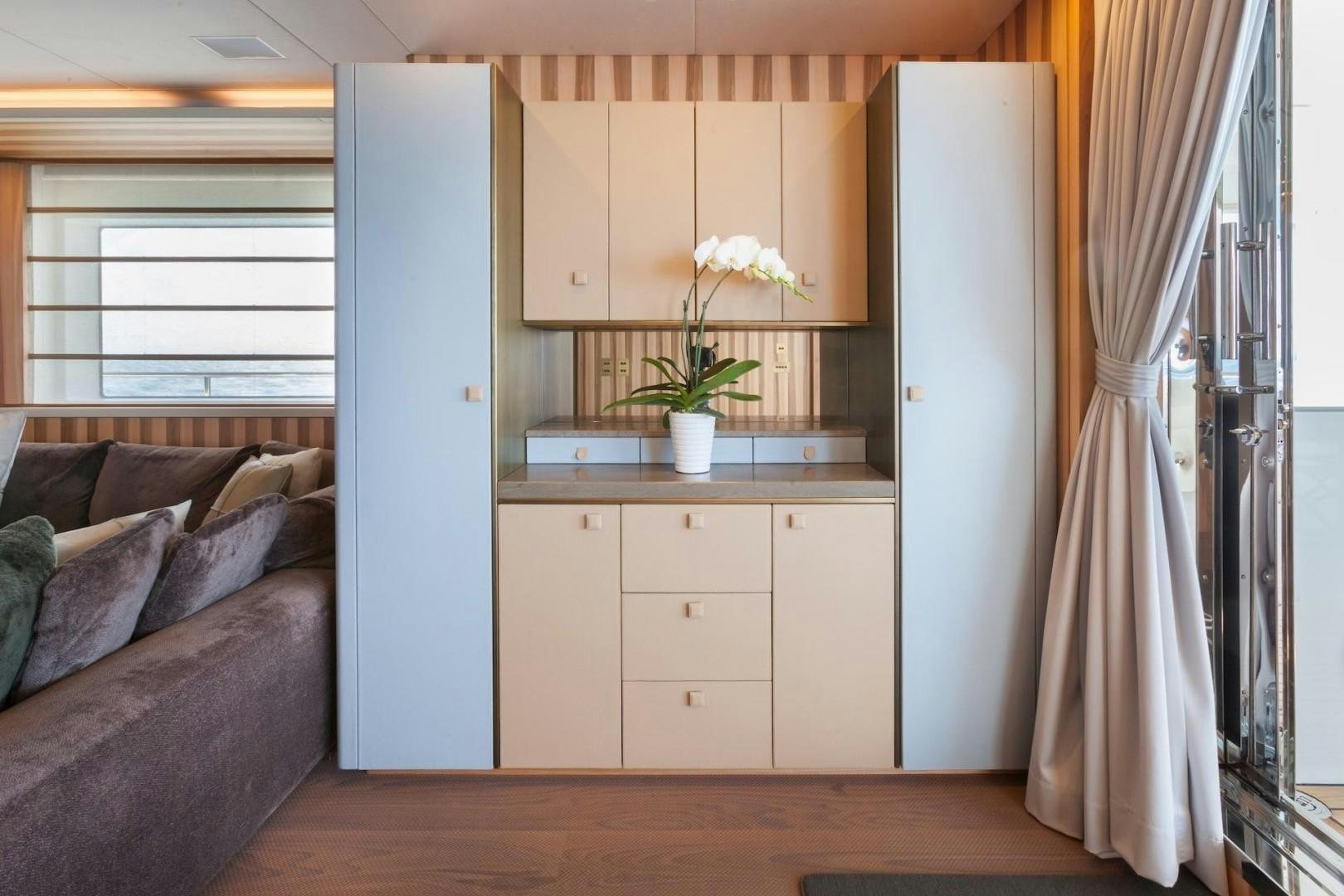 a room with a couch and a table aboard ACALA Yacht for Sale