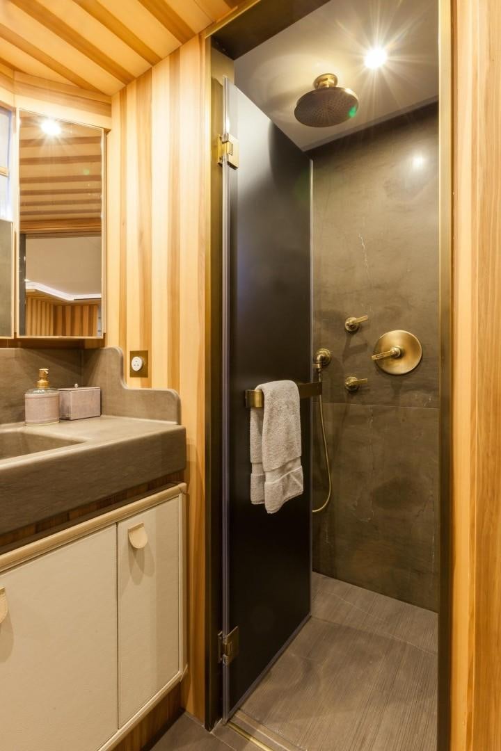 a bathroom with a shower unit and sink aboard ACALA Yacht for Sale