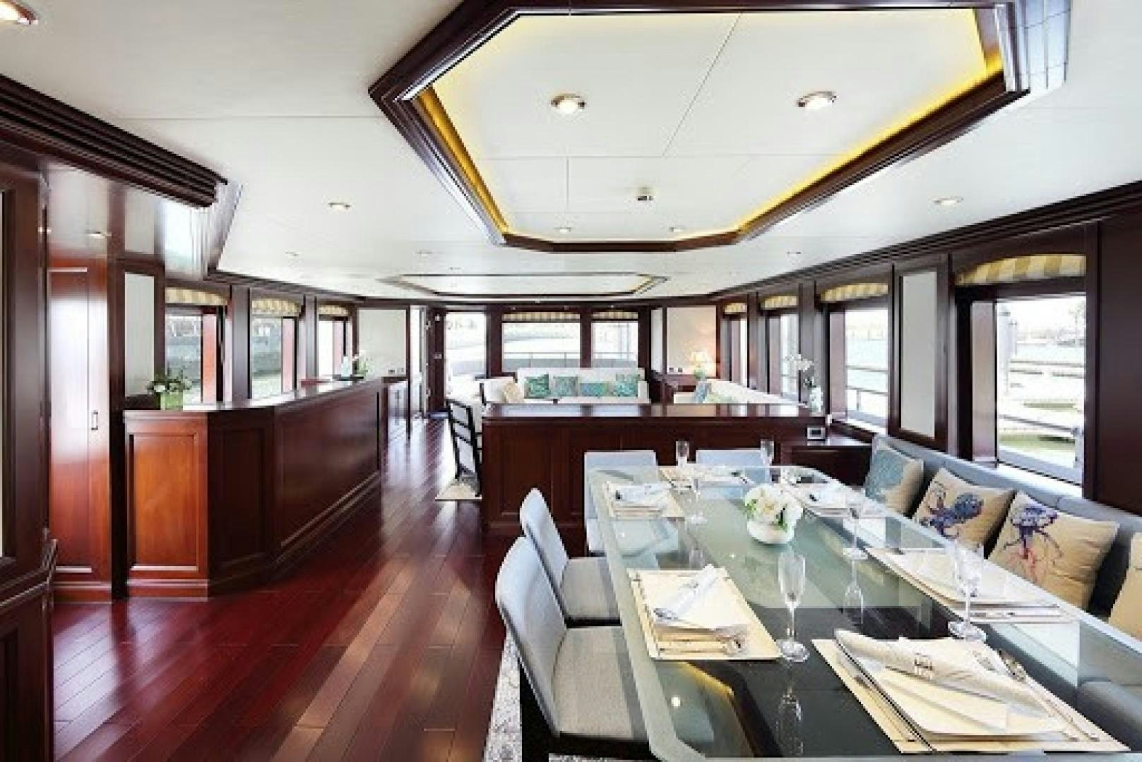 a large dining room with a wood floor aboard SAMSARA Yacht for Sale