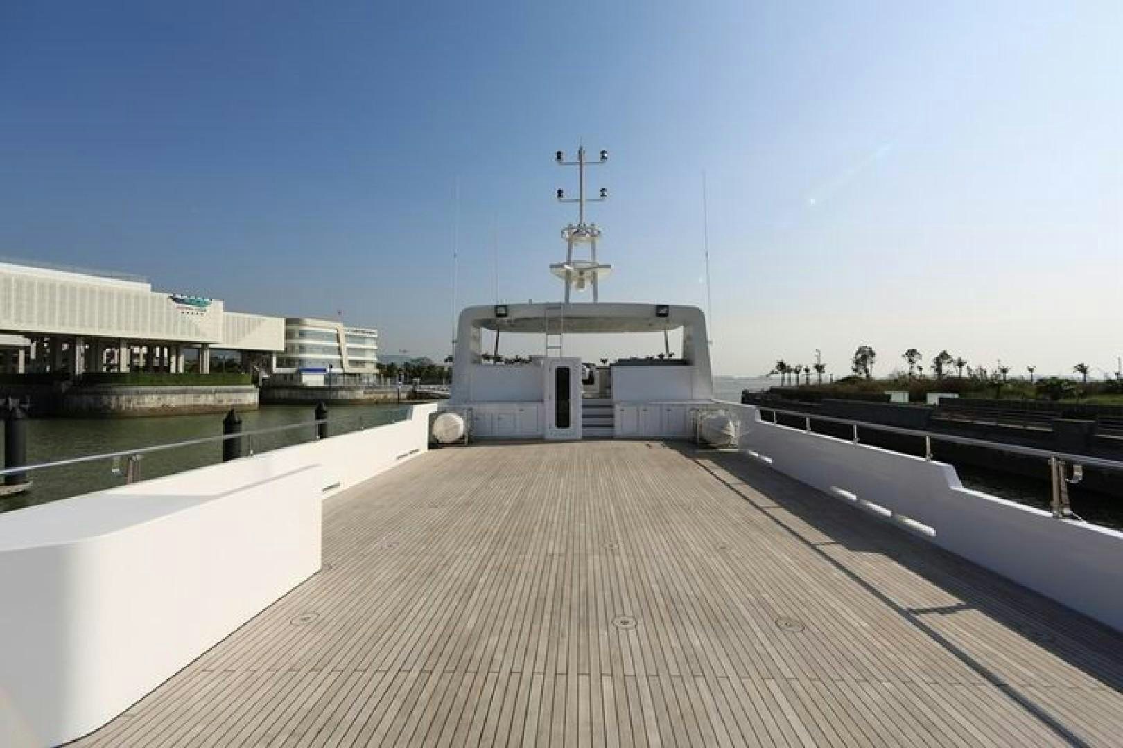 a dock with a building in the background aboard SAMSARA Yacht for Sale