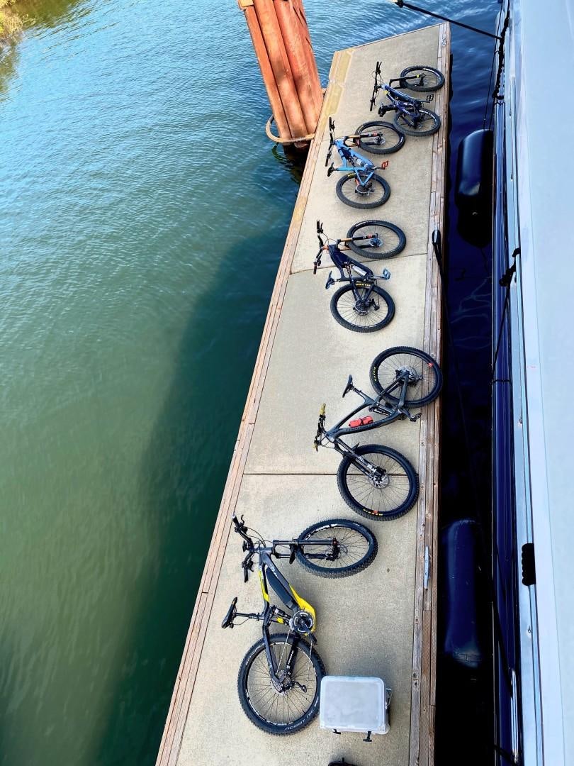 a bike is parked on the side of a boat aboard SAMSARA Yacht for Sale