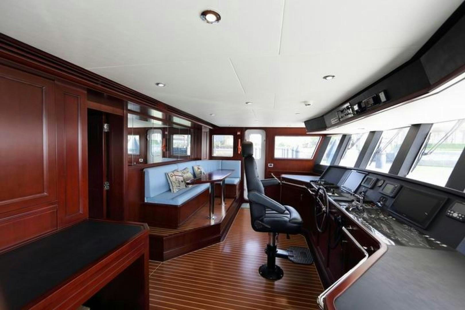a room with a desk and a couch aboard SAMSARA Yacht for Sale