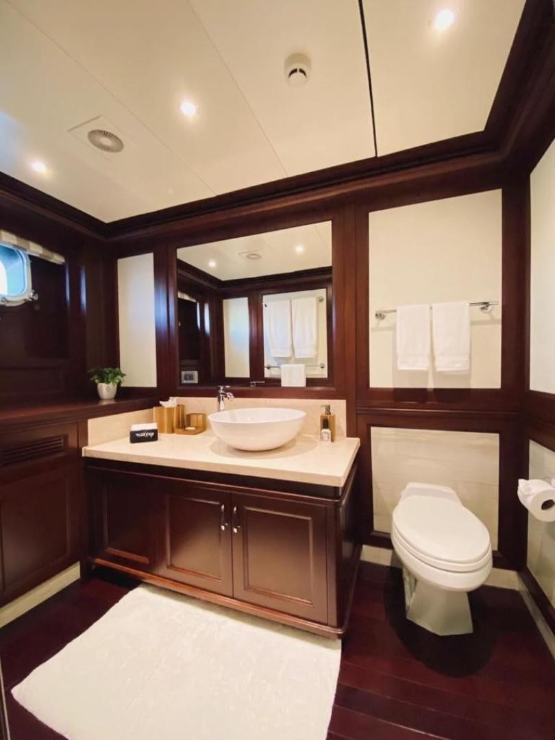 a bathroom with a sink and a toilet aboard SAMSARA Yacht for Sale