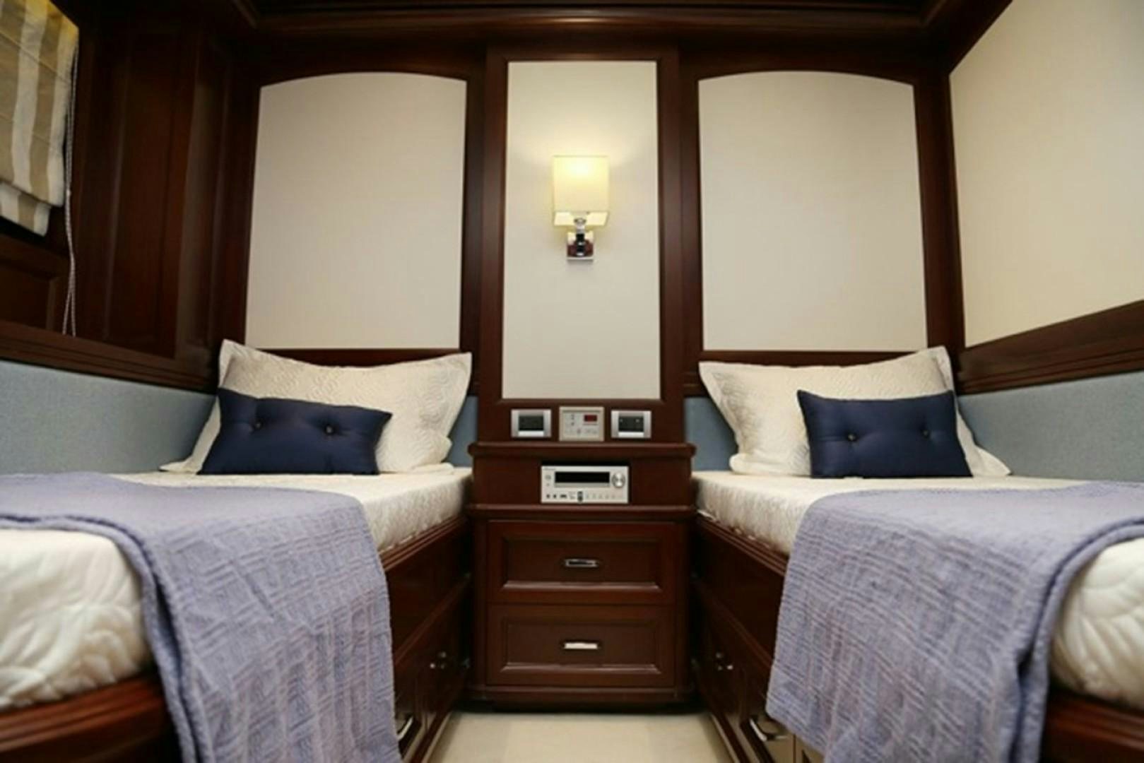 a couple of beds in a hotel room aboard SAMSARA Yacht for Sale