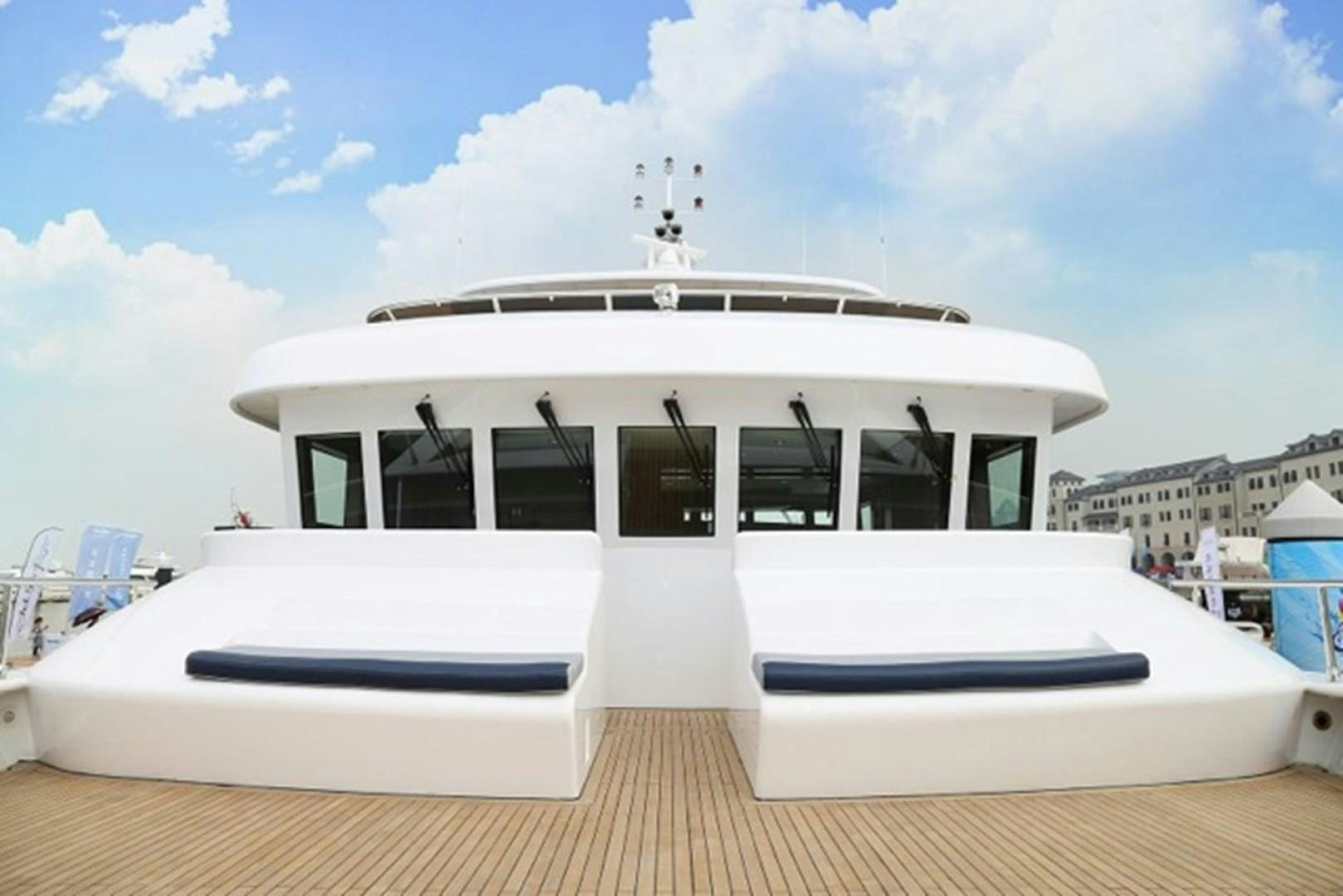 a white boat on a wooden deck aboard SAMSARA Yacht for Sale