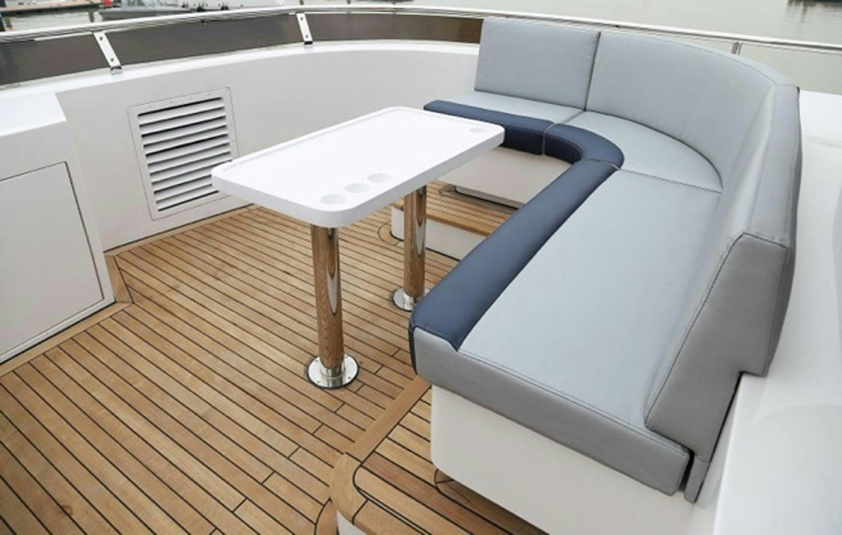 a white table and chairs aboard SAMSARA Yacht for Sale