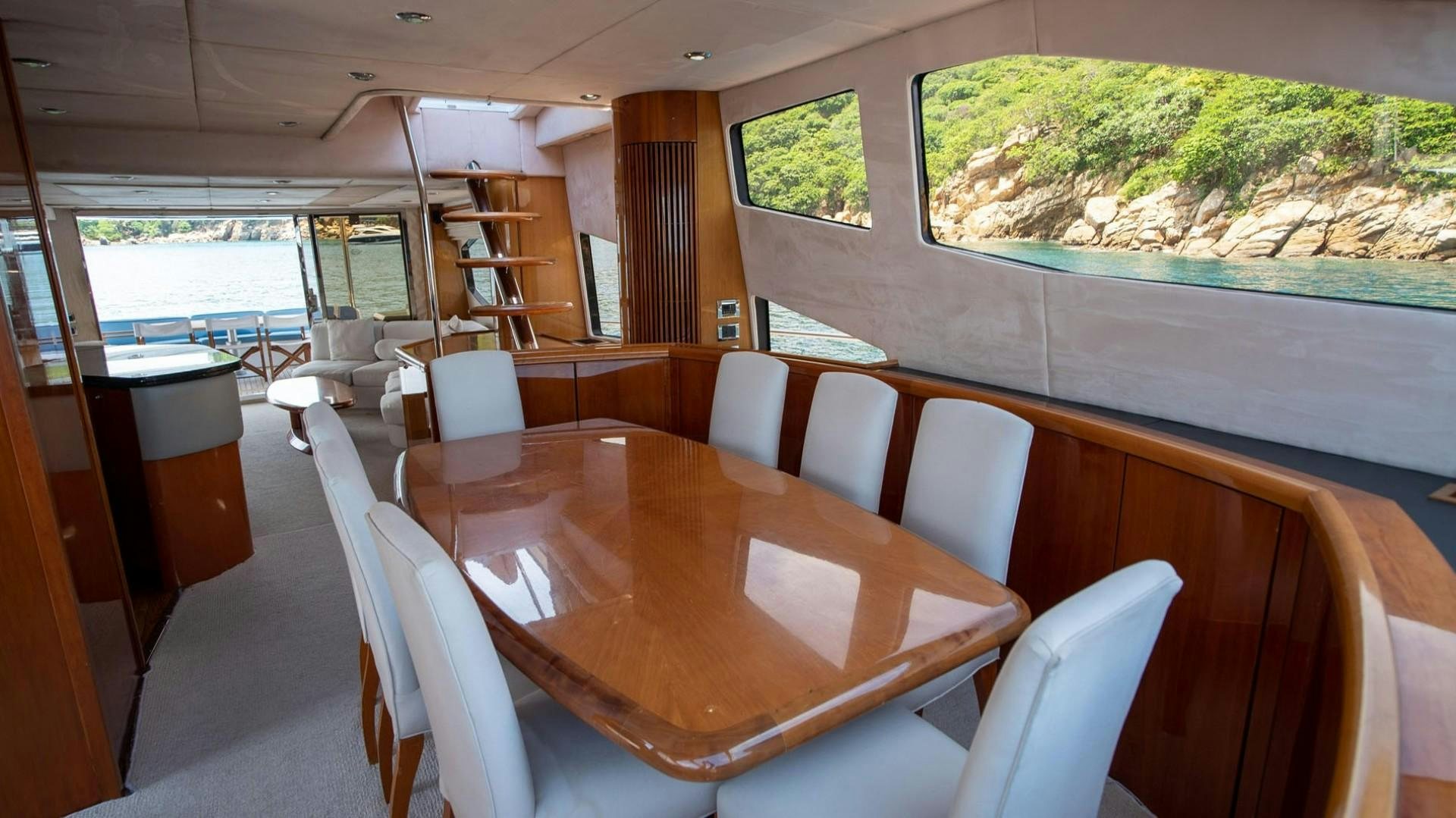 a table with chairs around it aboard LUCKY Yacht for Sale