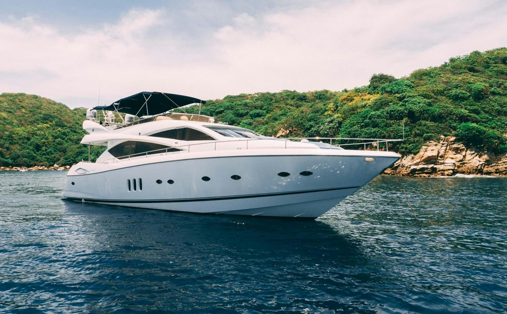 a white yacht on the water aboard LUCKY Yacht for Sale