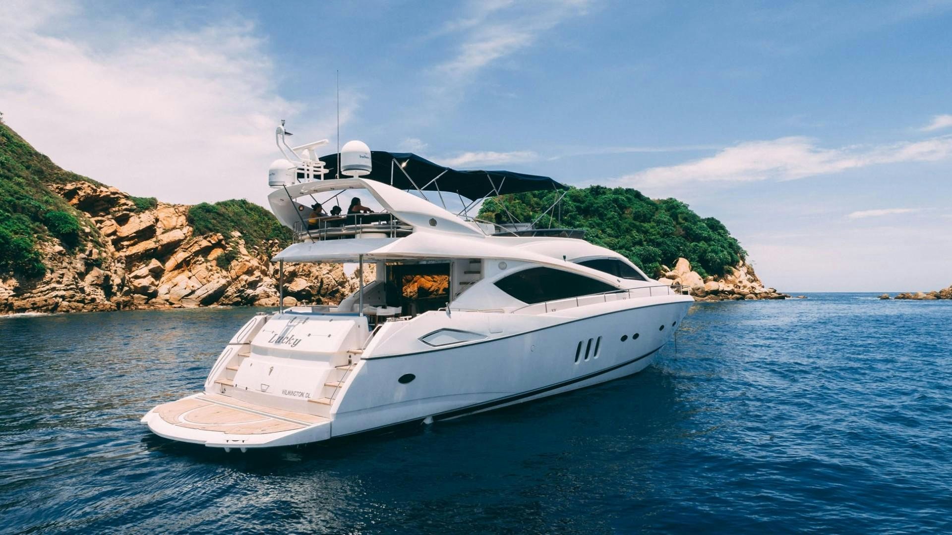 a white yacht on the water aboard LUCKY Yacht for Sale