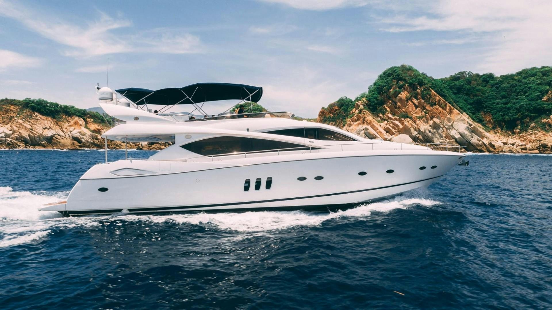 a white yacht on the water aboard LUCKY Yacht for Sale