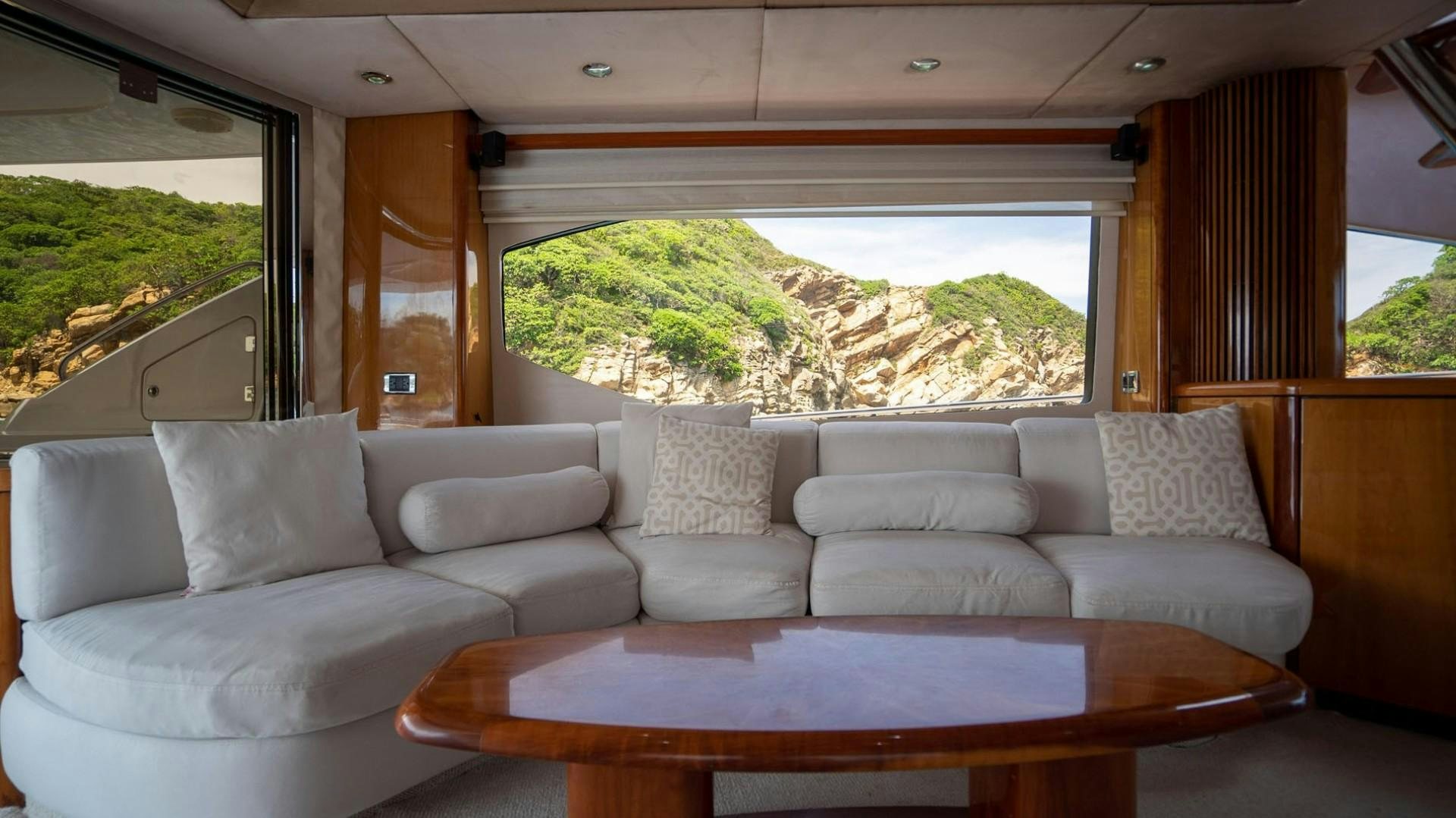 a white couch in a room aboard LUCKY Yacht for Sale
