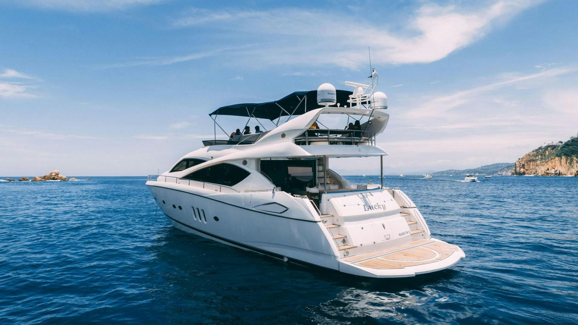 a white yacht in the water aboard LUCKY Yacht for Sale