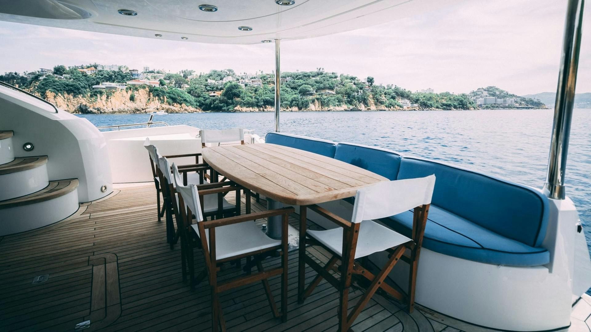 a table and chairs on a boat aboard LUCKY Yacht for Sale